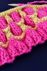 bright pink and yellow chunky knitting using mosaic technique 