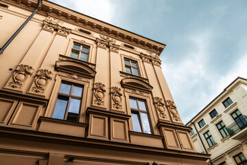 Facade of an old classic building in Krakow, Poland