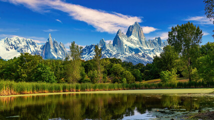 A body of water with a mountain in the background