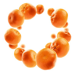 Whole oranges levitate on a white background