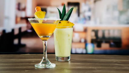 gooseberry cocktail with pilla decoration and pineapple cocktail in a glass, in a bar or restaurant