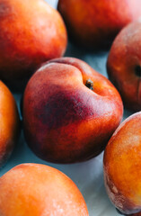 Fototapeta na wymiar Fresh ripe peaches on the table, close-up.