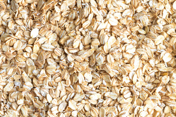 Heap of dry raw rolled oat flakes