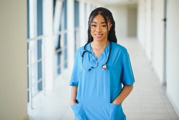 beautiful african american female pediatric nurse in modern office