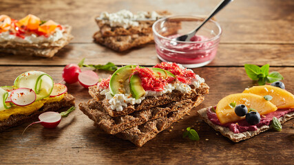 Healthy crispbread toasts placed on wooden table