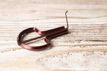 Musical instrument drymba. Traditional vargan. Small ethnic instrument. Folk drymba on wooden background