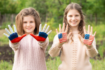 Friendship of peoples, exchange of students. Learning foreign languages. Child hands painted in...