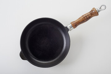 Frying pan with wooden handle