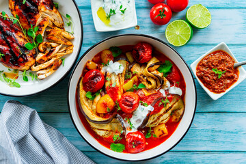 Grilled eggplant with tomatoes and bell pepper in a bowl