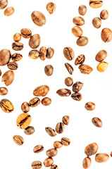 Falling coffee beans isolated on white background, clipping path, full depth of field. Cereal product. Hot drink. Close up. Harvesting. Natural background. Energy. Flying,vertical orientation