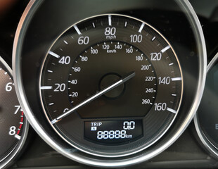 A close-up photo of a car speedometer showing mileage