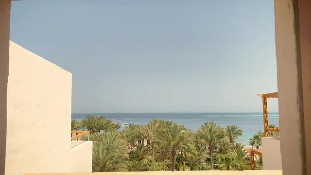Camera moving through window. Sea view background.
