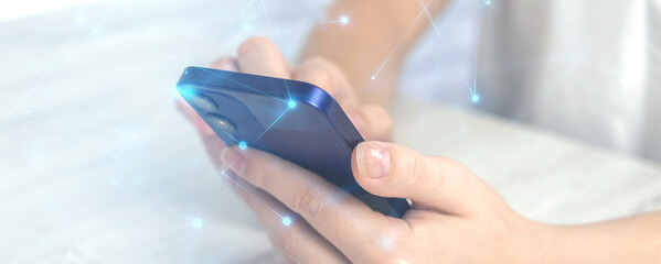 Banner technology networking concept, woman holding smartphone with abstract polygonal wireframe...