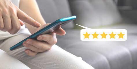 Happy customer review 5 five stars rating in excellent service satisfaction, woman sitting on sofa...