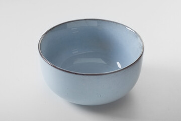 Empty ceramic bowl on white table