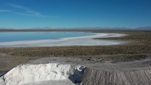 Aerial view of the salt mountain, with saline in the background.