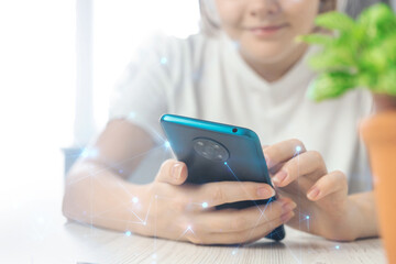 Technologu networking concept, woman holding smartphone with abstract polygonal wireframe, searching for digital innovation background photo