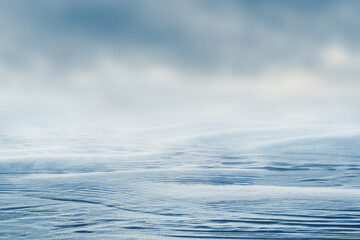 Winter view with snowy ground and blurred sky. Winter and Christmas background