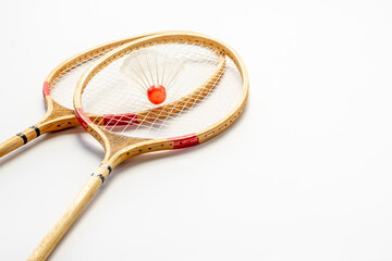 Two badminton rackets and shuttlecock close up