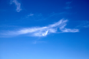 Light blue clouds on the blue sky.