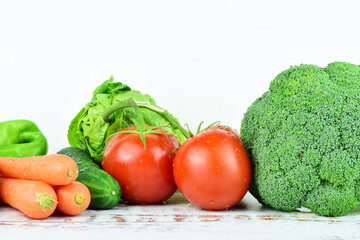 Fototapeta na wymiar Assortment of fresh vegetables on white background, essential for good health.