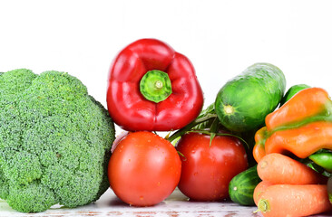 Assortment of fresh vegetables on white background, essential for good health. Copy space.