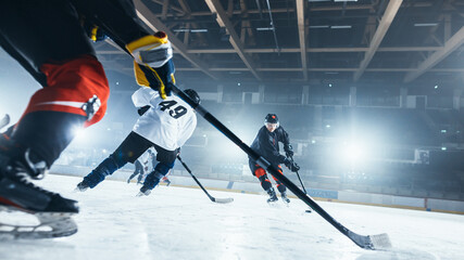 Ice Hockey Rink Arena: Professional Forward Player Attacks, Shows Expert Stickhandling, Dribbles, Handling Puck with Hockey Stick Beautifully, Defense Unable to Intercept. Low Angle View.