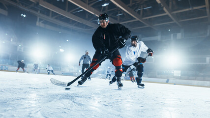 Ice Hockey Rink Arena: Professional Forward Player Masterfully Dribbles, Breaks Defense, Gives Perfect Pass and Riding On Camera. Strong Performance Teams Play.