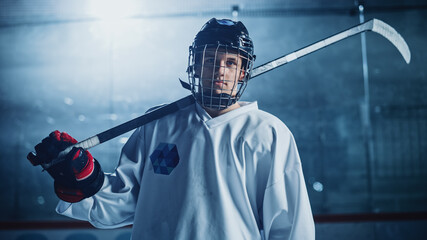 Ice Hockey Rink Arena: Portrait of Confident Professional Player, Wearing Wire Cage Face Mask,...