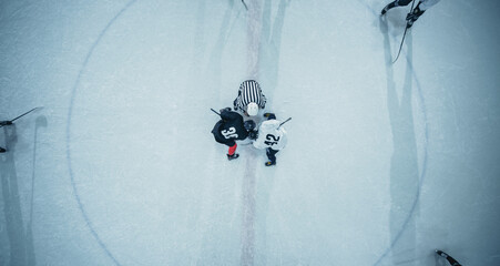 Top View Ice Hockey Rink Arena Game Start: Two Players Face off, Sticks Ready, Referee Ready to...
