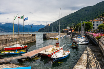 Small marina in Bellano, lake Como, Lombardy, Italy. There are small boats and dinghy in marina....
