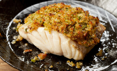 Appetizing fish fillet baked with breadcrumbs