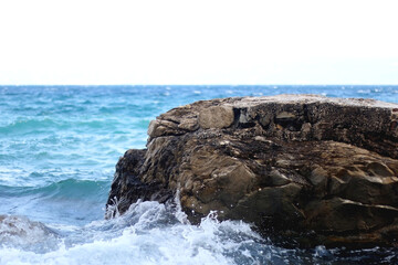 Rocks and waves on a beach. Selective focus.