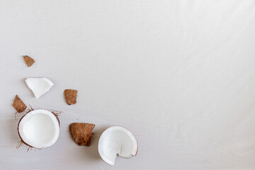 Recently broked coconut on a white background. 