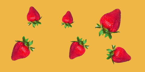 Seamless background with fresh strawberries. Juicy strawberries isolated on a yellow background.