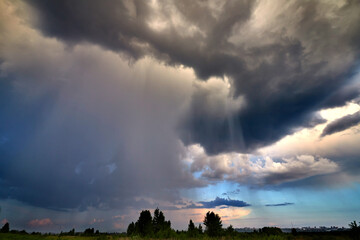 Obraz na płótnie Canvas Dramatic evenind sky with clouds. Summer evening after rain.