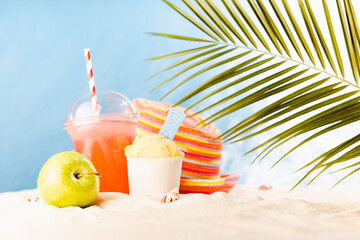 Healthy summer vacation and relaxation on tropical beach with cold drink, ice cream, fruit and sun...
