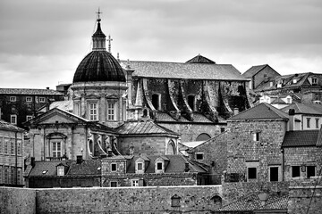 Fototapeta na wymiar Churches, bell towers and roofs of houses in the city of Dubrovnik