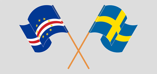 Crossed and waving flags of Cape Verde and Sweden