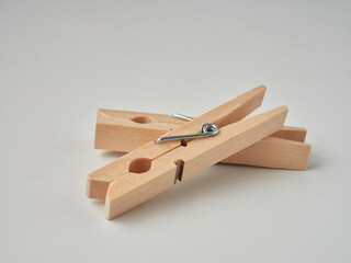 Set of wooden clothes pins on white background