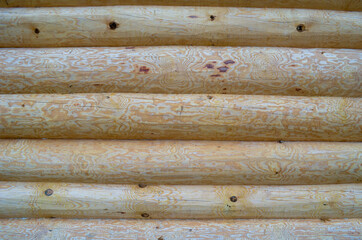 Texture of wooden logs wall for background
