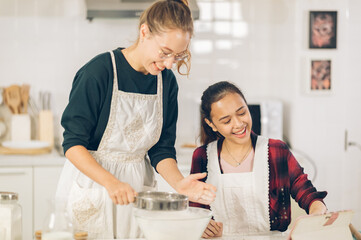 Obraz premium two Female Baker make Cupcakes in chitcken