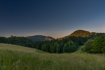 Obraz premium Semriach village with Schockl hill over in sunset sunny morning