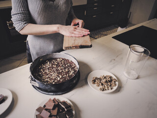 Woman cooking a chocolate cake in kitchen