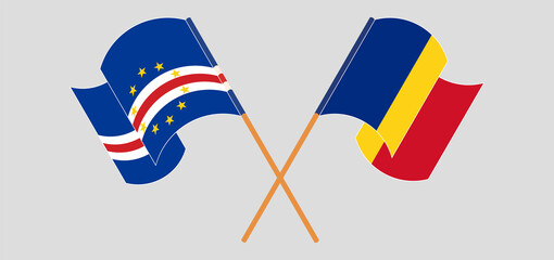 Crossed and waving flags of Cape Verde and Romania