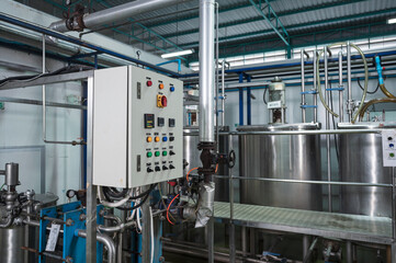 Control panel of stainless pipeline and tanks system at beverage processing plant
