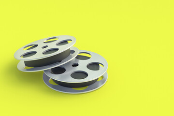 Film reel in metal frame on yellow background. Cinematography tape. Retro technology. Cinema premiere. Documentary shooting. Copy space. 3d render