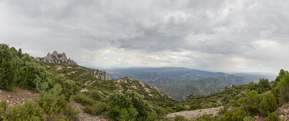 Fototapeta na wymiar Panoramic view from Serra llarga above Montserrat Abbey, Barcelona.