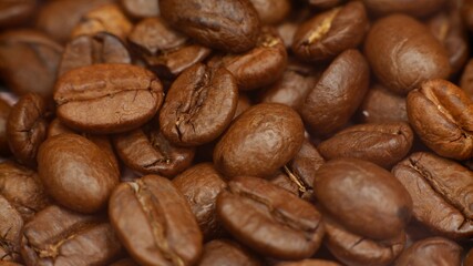 many roasted fresh coffee beans as a close-up
