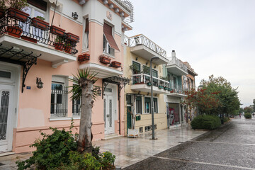 Athens, Greece - September 24, 2019: Nice cozy residential traditional attica street and buildings in city downtown on a rainy day. Plaka old neighbourhood of Athens, around Acropolis